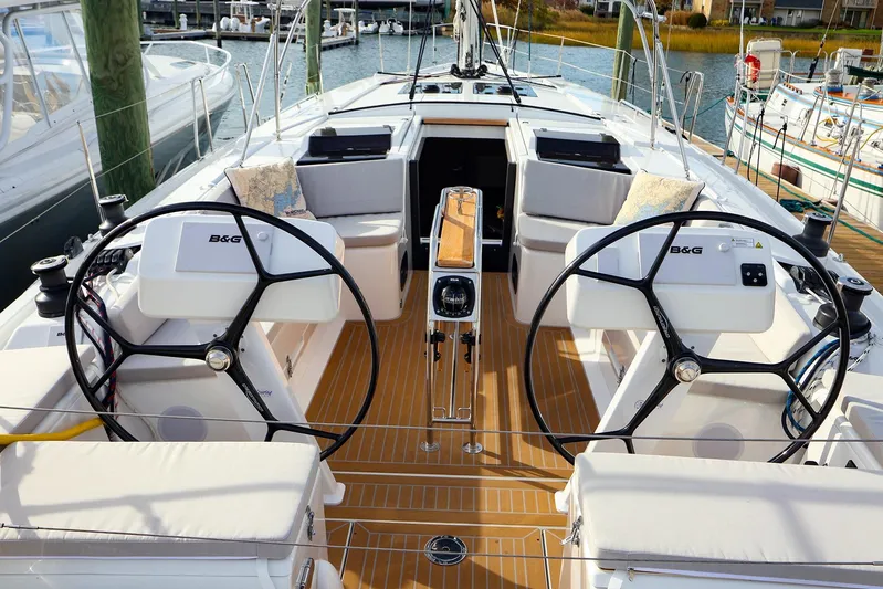  Yacht Photos Pics 2025 Hanse 458 yacht cockpit with dual steering wheels and modern navigation equipment.
