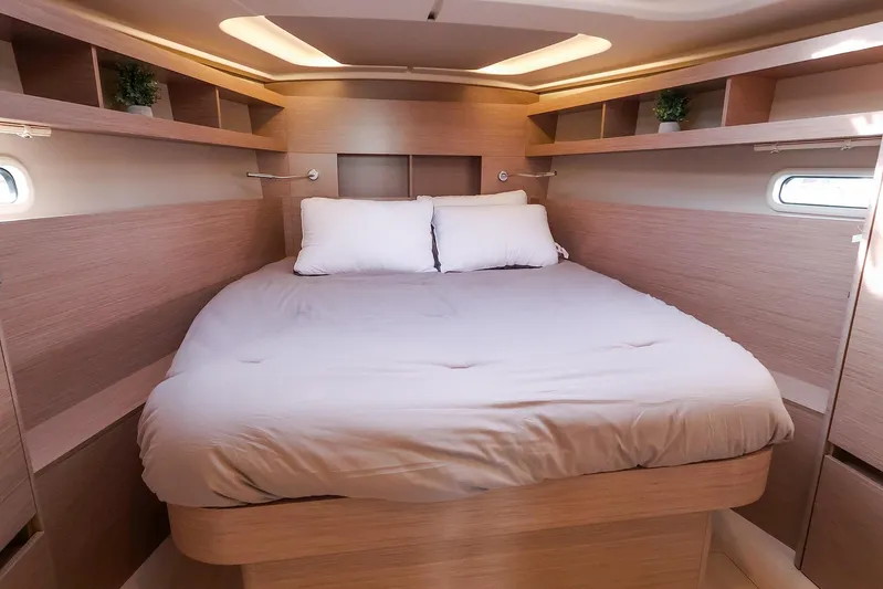  Yacht Photos Pics Luxurious cabin interior of 2025 Hanse 458 yacht with cozy bed and modern design.
