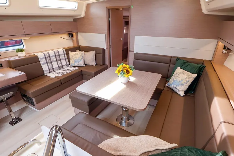  Yacht Photos Pics Luxurious interior of 2025 Hanse 458 yacht with cozy seating and elegant decor.