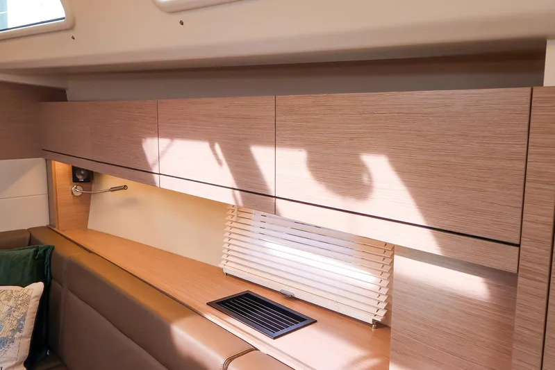  Yacht Photos Pics Interior of 2025 Hanse 458 yacht with modern wood cabinetry and window blinds.
