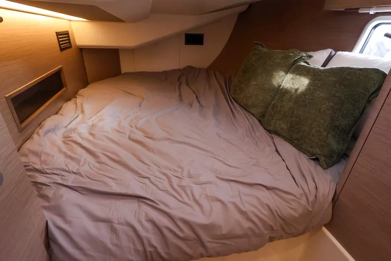  Yacht Photos Pics Cozy cabin interior of 2025 Hanse 458 yacht with comfortable bedding.