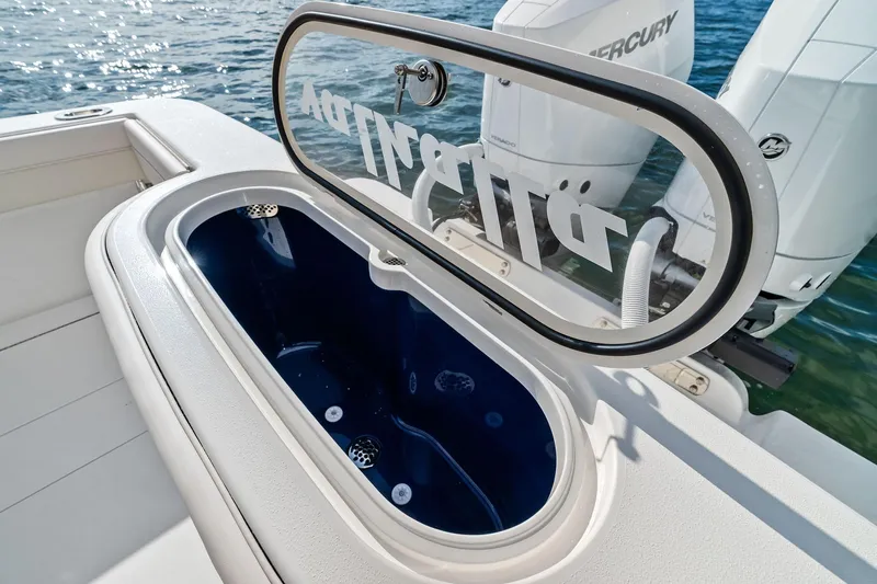 New Valhalla Boatworks V-33 Yacht Photos Pics 2026 Valhalla Boatworks V-33 livewell with open lid, showcasing interior and Mercury engines.