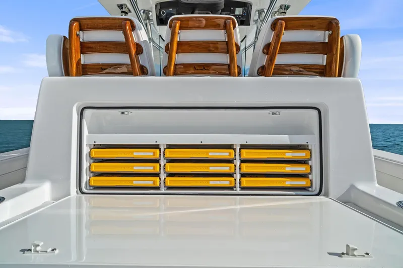 New Valhalla Boatworks V-33 Yacht Photos Pics 2026 Valhalla Boatworks V-33 with storage compartments and wooden seating on deck.