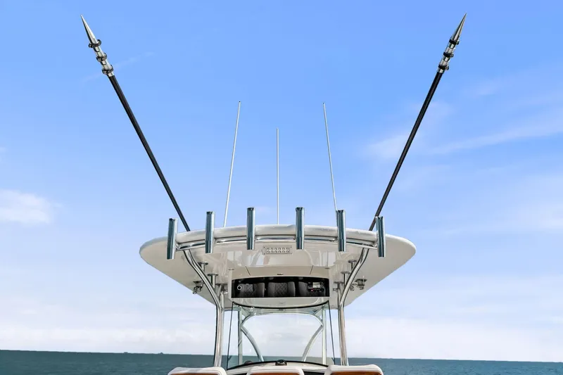 New Valhalla Boatworks V-33 Yacht Photos Pics 2026 Valhalla Boatworks V-33 with outriggers against a clear blue sky.