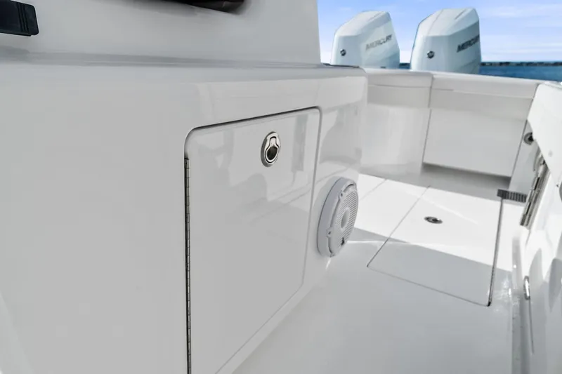 New Valhalla Boatworks V-33 Yacht Photos Pics 2026 Valhalla Boatworks V-33 interior with storage compartment and speaker.