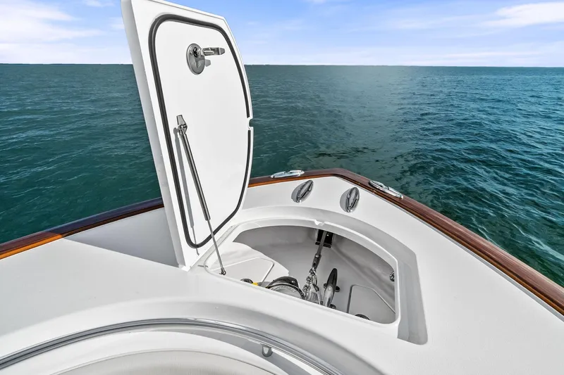 New Valhalla Boatworks V-33 Yacht Photos Pics 2026 Valhalla Boatworks V-33 anchor compartment open on calm ocean.