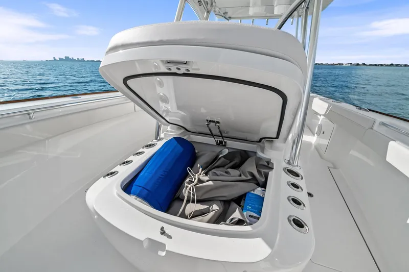 New Valhalla Boatworks V-33 Yacht Photos Pics 2026 Valhalla Boatworks V-33 storage compartment open on deck, ocean view.