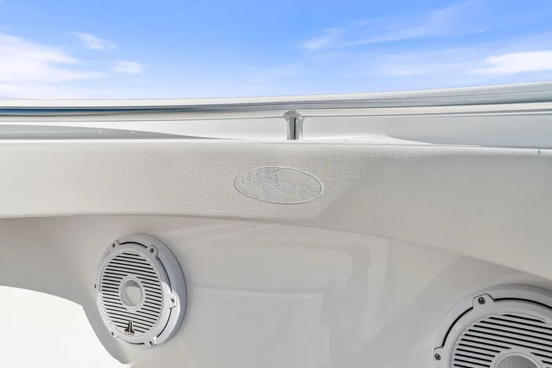 New Valhalla Boatworks V-33 Yacht Photos Pics 2026 Valhalla Boatworks V-33 interior detail with speakers and logo, under a clear blue sky.