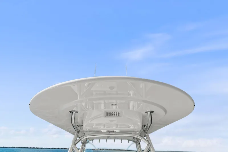 New Valhalla Boatworks V-33 Yacht Photos Pics 2026 Valhalla Boatworks V-33 T-top against clear blue sky.