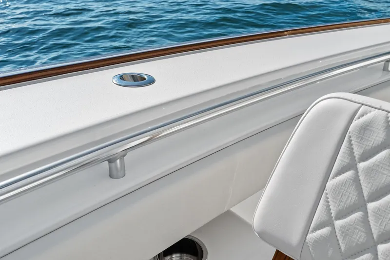 New Valhalla Boatworks V-33 Yacht Photos Pics 2026 Valhalla Boatworks V-33 interior detail with white upholstery and ocean backdrop.