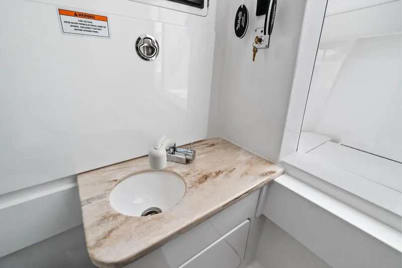 New Valhalla Boatworks V-33 Yacht Photos Pics 2026 Valhalla Boatworks V-33 interior sink with marble countertop and faucet.