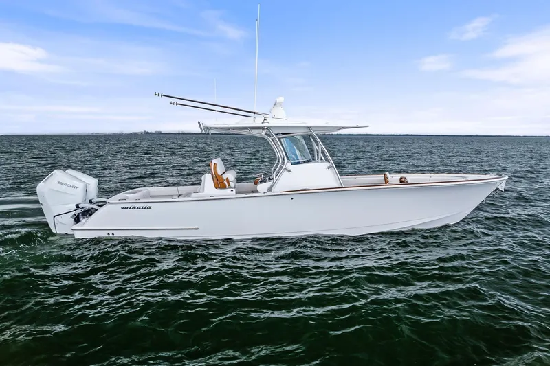 New Valhalla Boatworks V-33 Yacht Photos Pics 2026 Valhalla Boatworks V-33 cruising on open water under a clear blue sky.