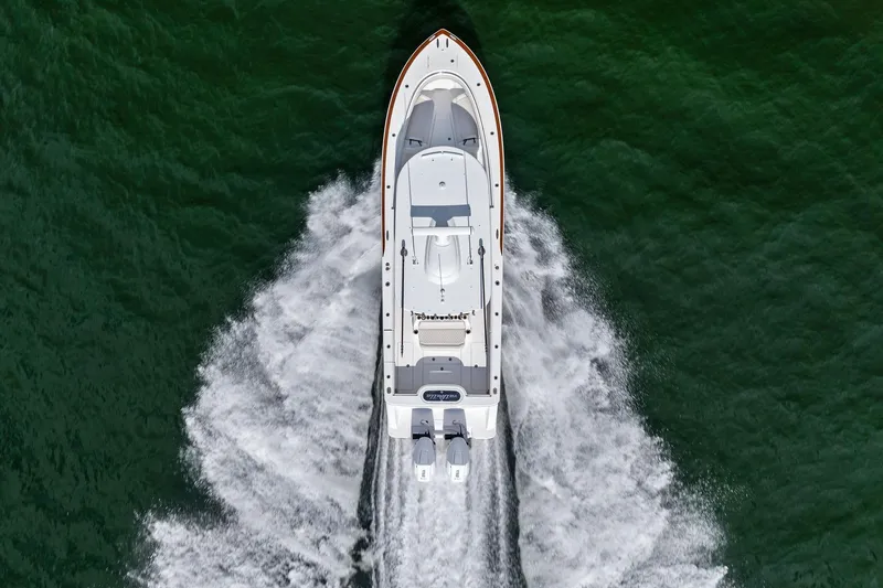 New Valhalla Boatworks V-33 Yacht Photos Pics 2026 Valhalla Boatworks V-33 cruising on open water, aerial view.