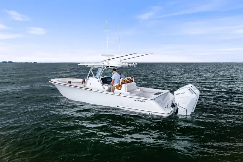 New Valhalla Boatworks V-33 Yacht Photos Pics 2026 Valhalla Boatworks V-33 cruising on open water under a clear blue sky.