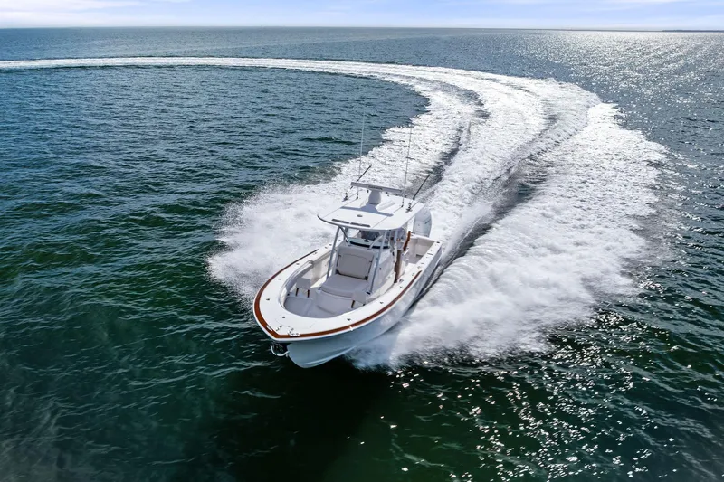 New Valhalla Boatworks V-33 Yacht Photos Pics 2026 Valhalla Boatworks V-33 cruising swiftly on open water, creating a dynamic wake.