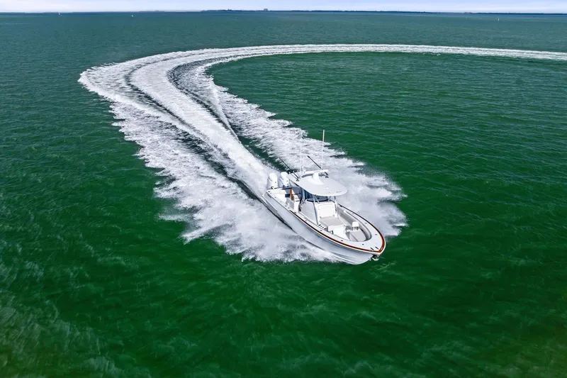 New Valhalla Boatworks V-33 Yacht Photos Pics 2026 Valhalla Boatworks V-33 cruising swiftly on open water, creating a dynamic wake.