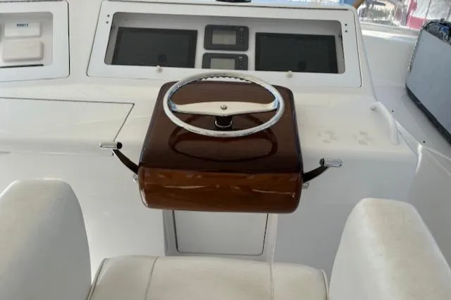  Yacht Photos Pics 2008 Viking 52 Convertible yacht helm with steering wheel and navigation screens.