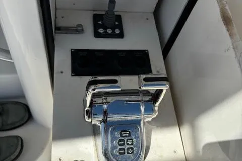  Yacht Photos Pics Control panel of a 2008 Viking 52 Convertible yacht, featuring chrome throttle and joystick.