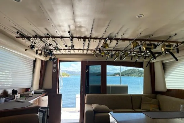  Yacht Photos Pics Interior of 2008 Viking 52 Convertible yacht with fishing rods and ocean view.