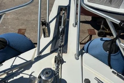  Yacht Photos Pics Bow of 2008 Viking 52 Convertible yacht with anchor chain and blue fenders.