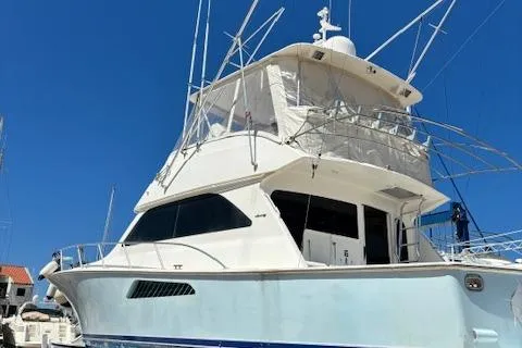  Yacht Photos Pics 2008 Viking 52 Convertible yacht docked under clear blue sky.