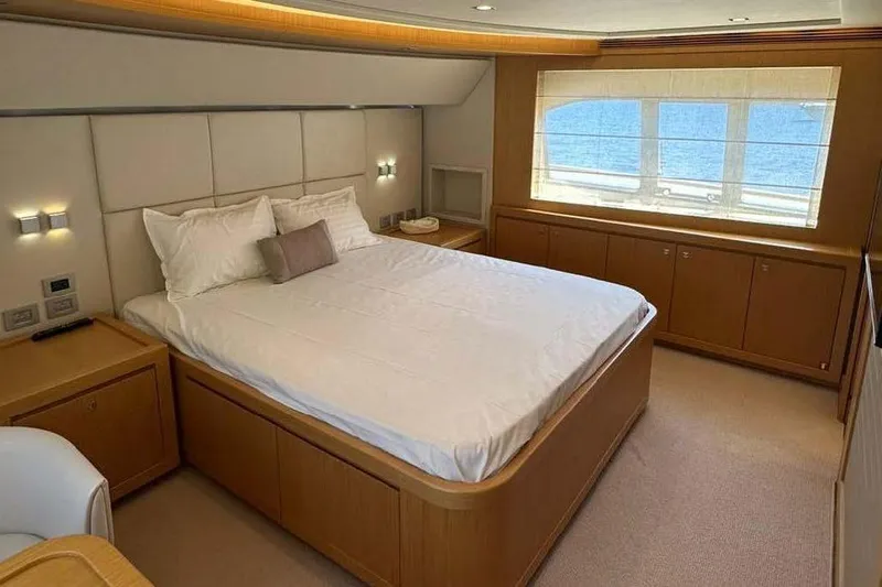  Yacht Photos Pics Luxurious bedroom interior of 2012 Ferretti Yachts Customline Navetta 26 with ocean view.