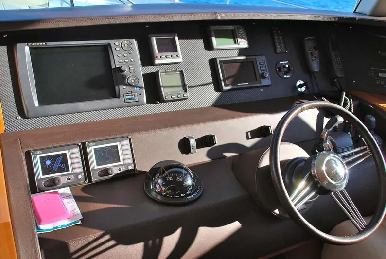  Yacht Photos Pics Helm of 2011 Fountaine Pajot Queensland 55 with navigation instruments and steering wheel.