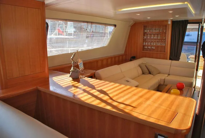  Yacht Photos Pics Luxurious interior of 2011 Fountaine Pajot Queensland 55 yacht with elegant wood finish.