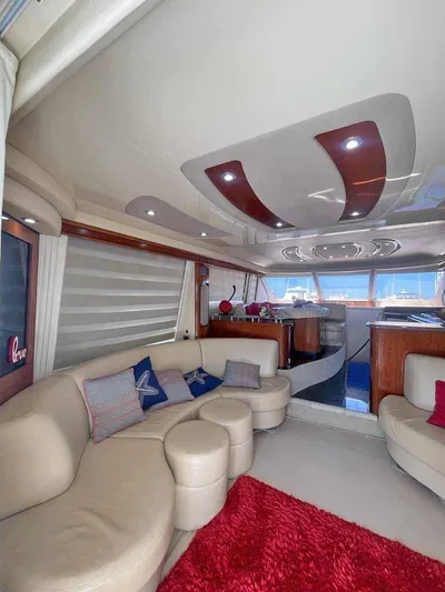  Yacht Photos Pics Luxurious interior of a 2005 Sea Ray Sedan Bridge yacht with plush seating.