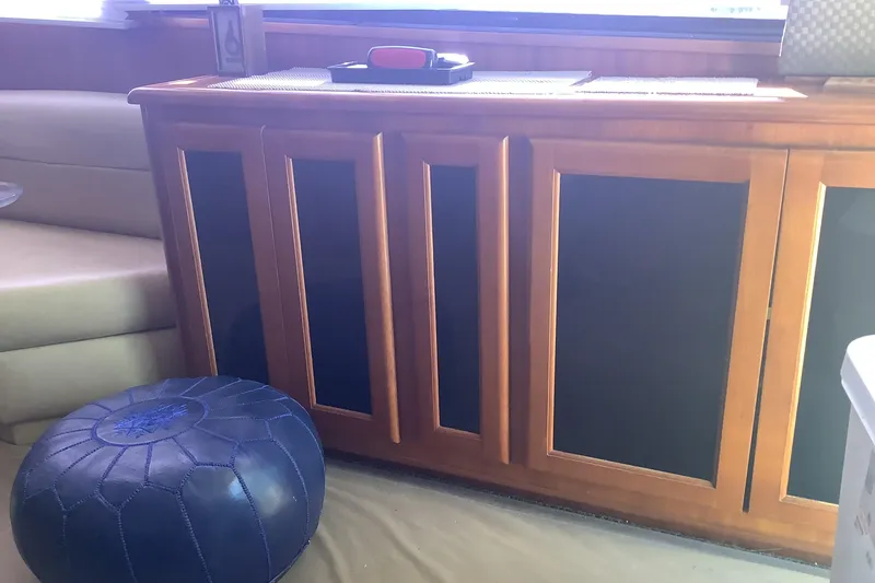 Fourth Quarter Yacht Photos Pics Interior of 1994 Viking 50' Convertible Sportfish with wooden cabinetry and blue pouf.