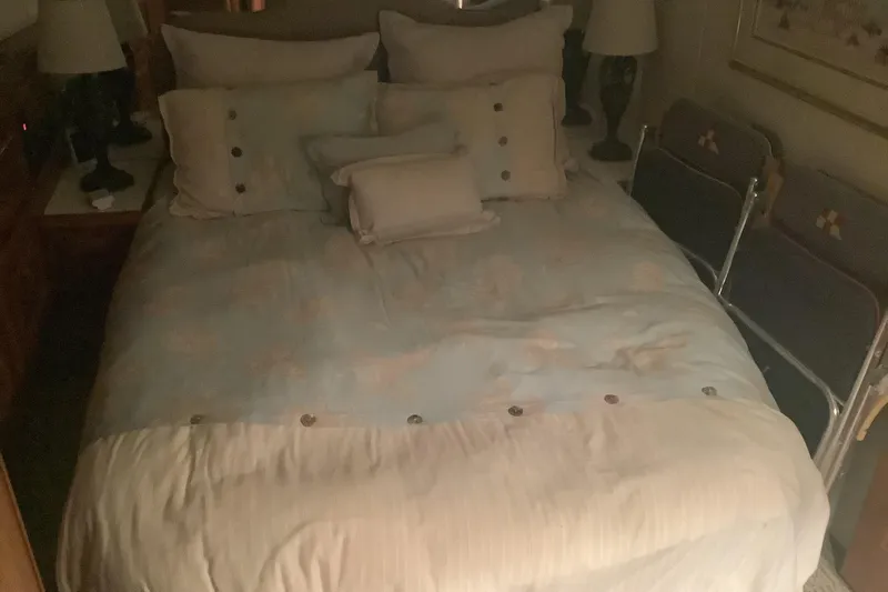 Fourth Quarter Yacht Photos Pics Cozy bedroom interior on a 1994 Viking 50' Convertible Sportfish yacht.