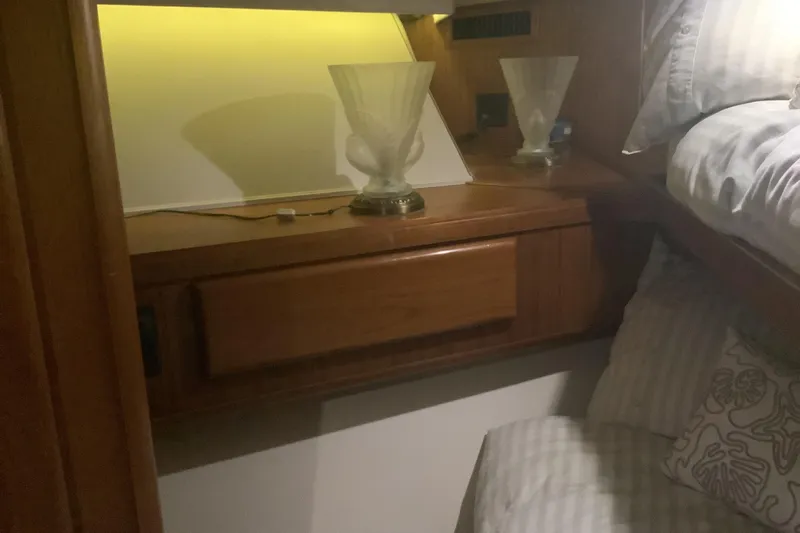 Fourth Quarter Yacht Photos Pics Interior cabin of 1994 Viking 50' Convertible Sportfish with wooden cabinetry and soft lighting.