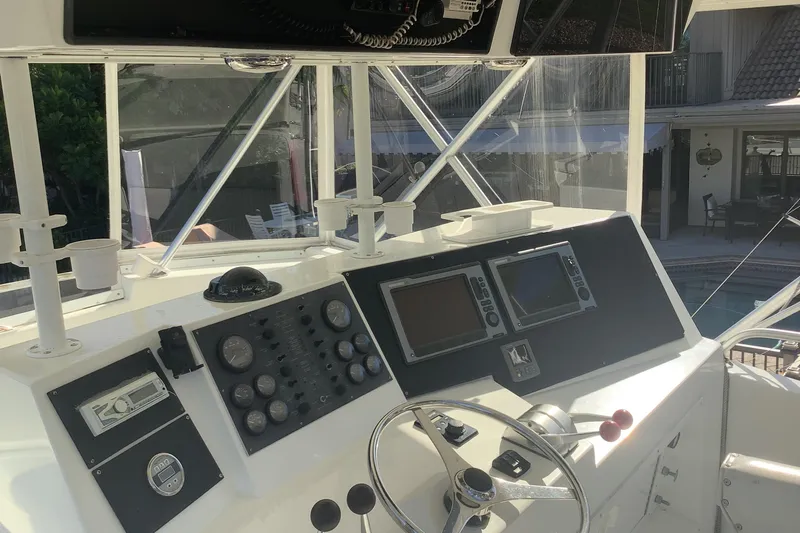 Fourth Quarter Yacht Photos Pics Control panel of a 1994 Viking 50' Convertible Sportfish boat, featuring navigation instruments.