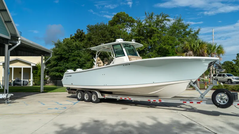  Yacht Photos Pics 2020 Sailfish 360 CC boat on a trailer, parked outdoors.