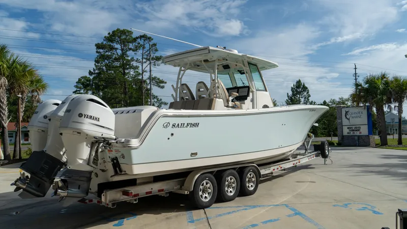  Yacht Photos Pics 2020 Sailfish 360 CC boat on trailer with Yamaha engines, parked outdoors.