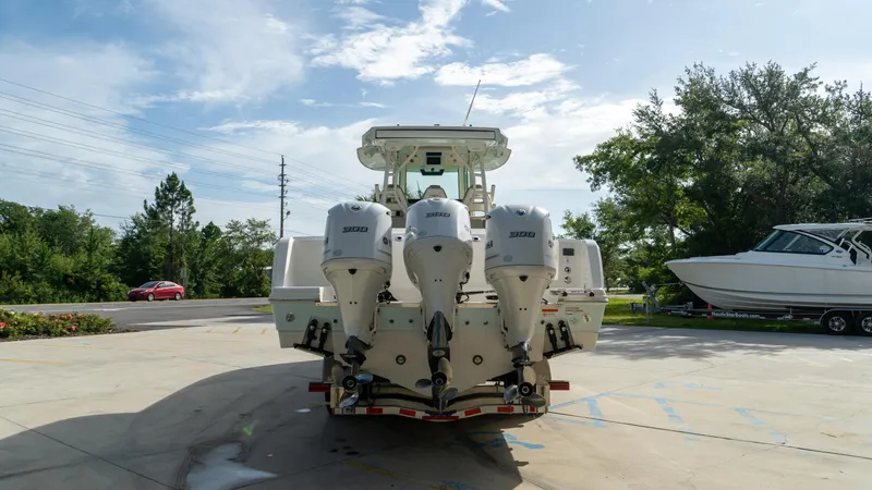  Yacht Photos Pics 2020 Sailfish 360 CC boat with triple outboard engines, parked outdoors.