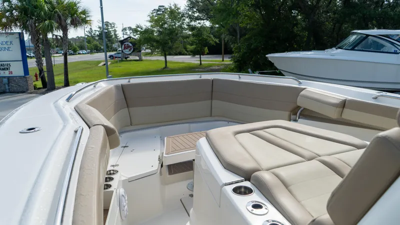  Yacht Photos Pics 2020 Sailfish 360 CC boat with spacious seating and cup holders, docked outdoors.