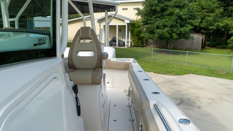  Yacht Photos Pics 2020 Sailfish 360 CC boat interior with seating and console, parked outdoors.
