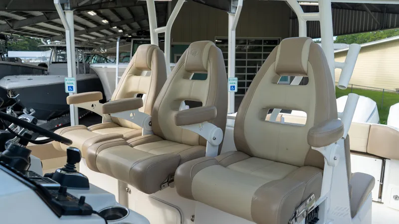  Yacht Photos Pics 2020 Sailfish 360 CC boat interior with three beige captain chairs.