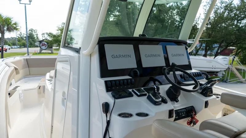  Yacht Photos Pics 2020 Sailfish 360 CC boat dashboard with Garmin navigation displays.