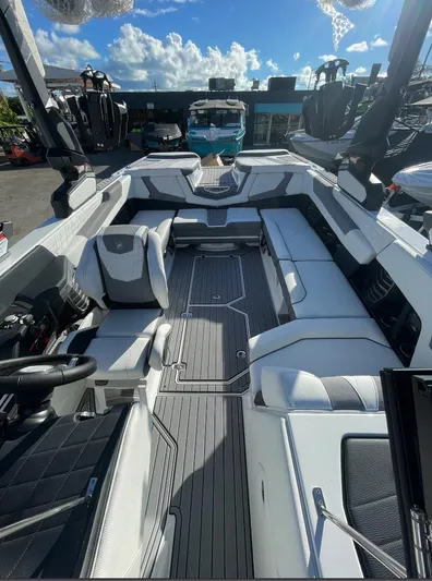  Yacht Photos Pics 2022 Nautique Super Air G23 boat interior with sleek seating and modern design.