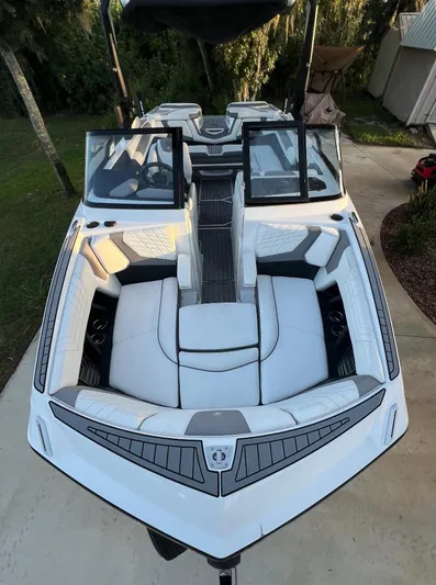  Yacht Photos Pics 2022 Nautique Super Air G23 boat with open seating and sleek design.