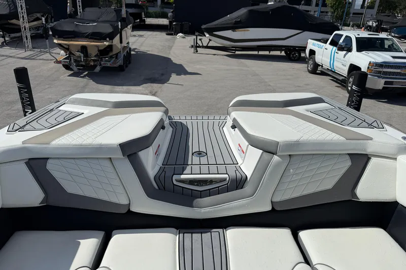  Yacht Photos Pics 2022 Nautique Super Air Nautique G23 boat interior with sleek seating and modern design.