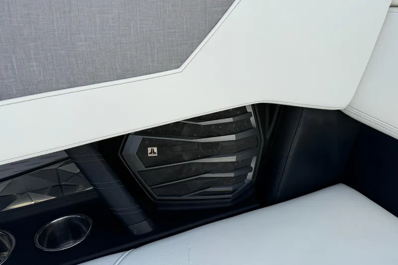  Yacht Photos Pics Interior detail of 2022 Nautique Super Air Nautique G23 boat with speaker and cup holders.