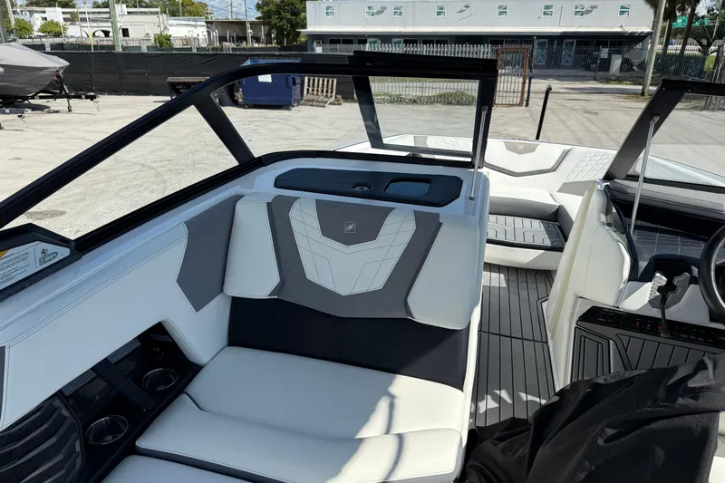  Yacht Photos Pics 2022 Nautique Super Air Nautique G23 interior with sleek seating and modern design.