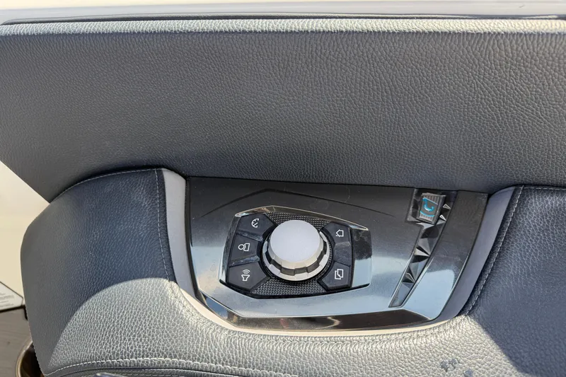  Yacht Photos Pics Control panel of 2022 Nautique Super Air Nautique G23 boat, featuring sleek design and buttons.