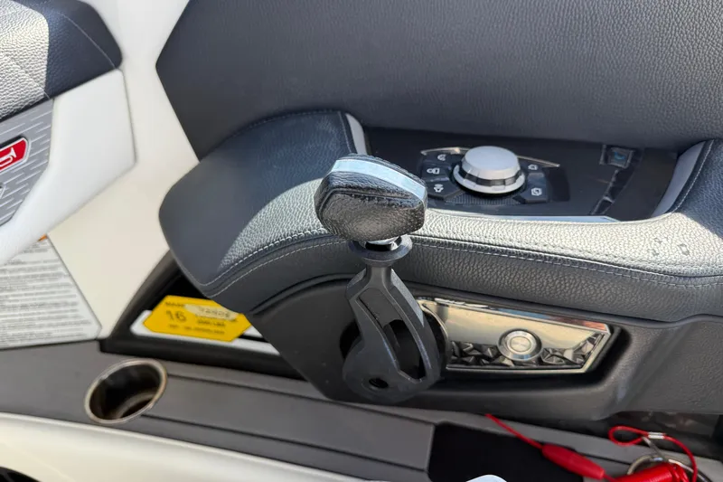  Yacht Photos Pics Control panel of 2022 Nautique Super Air Nautique G23 boat, featuring sleek design elements.