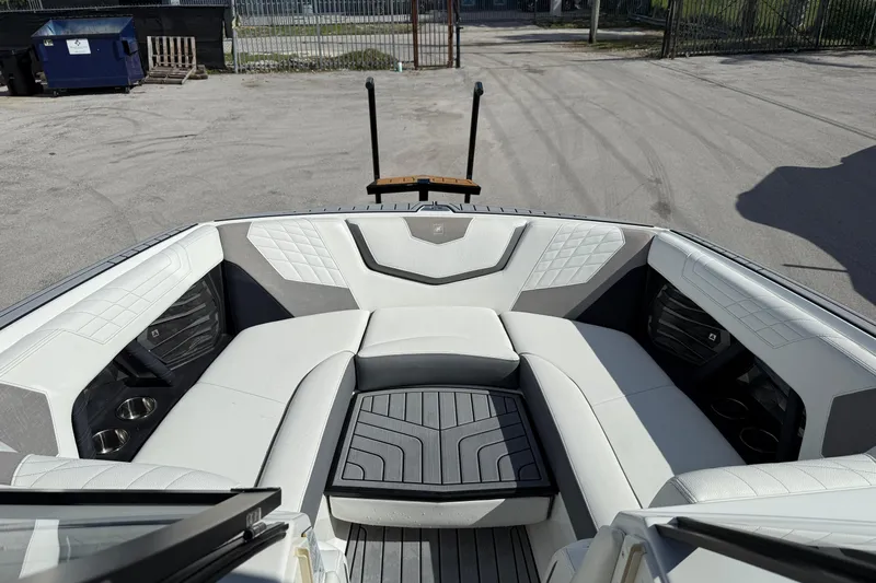  Yacht Photos Pics 2022 Nautique Super Air Nautique G23 boat interior with luxurious seating and modern design.