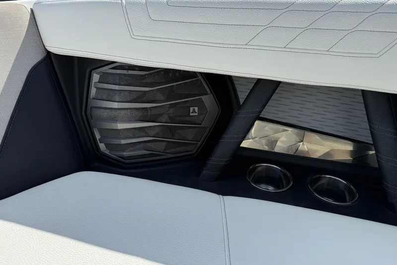  Yacht Photos Pics 2022 Nautique Super Air Nautique G23 interior with speaker and cup holders.