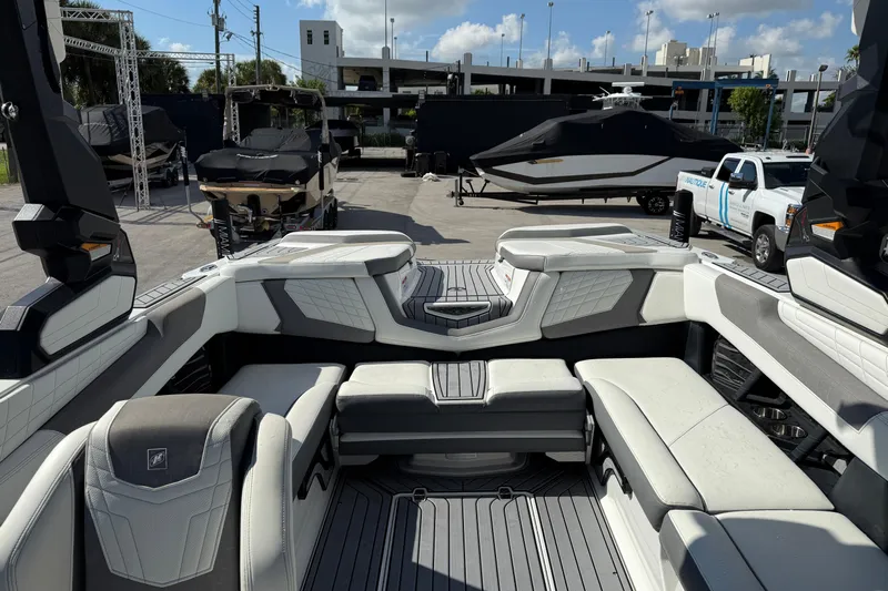  Yacht Photos Pics 2022 Nautique Super Air Nautique G23 interior with luxurious seating and modern design.